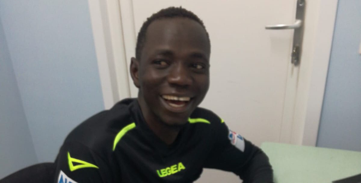 Primo arbitro migrante, Mustapha Jawara